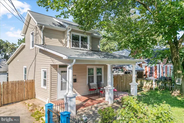 a view of a patio with table and chairs and potted plants