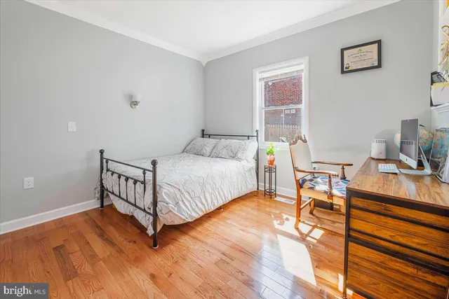 a bedroom with a bed and a table in it