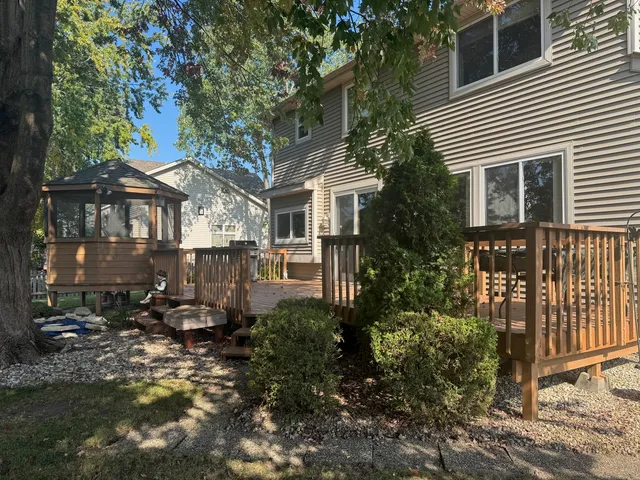 a view of a house with yard and sitting area