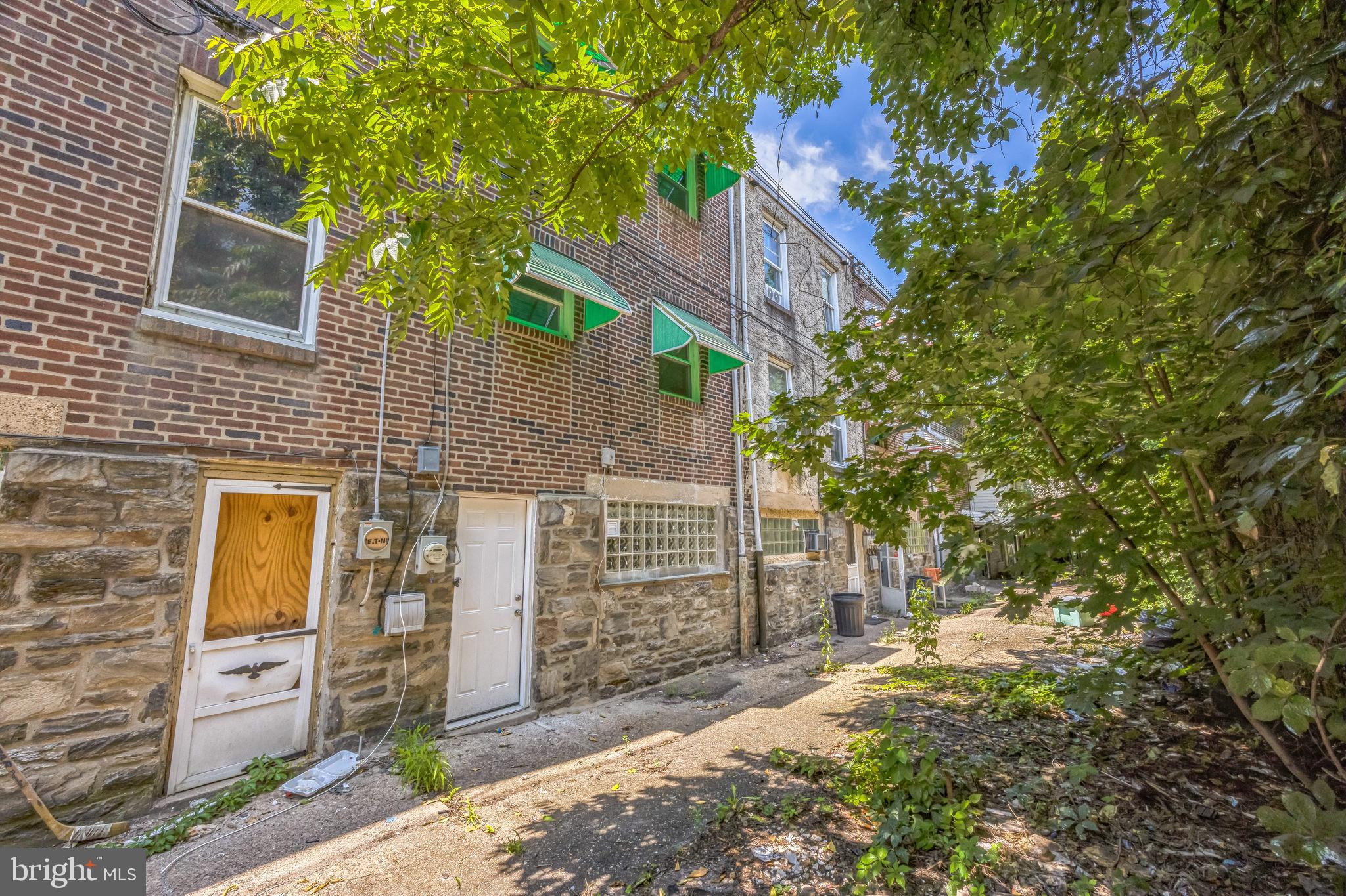 621 North 67th Street Philadelphia, PA 19151 - Photo 13 of 20 a front view of a house with a tree