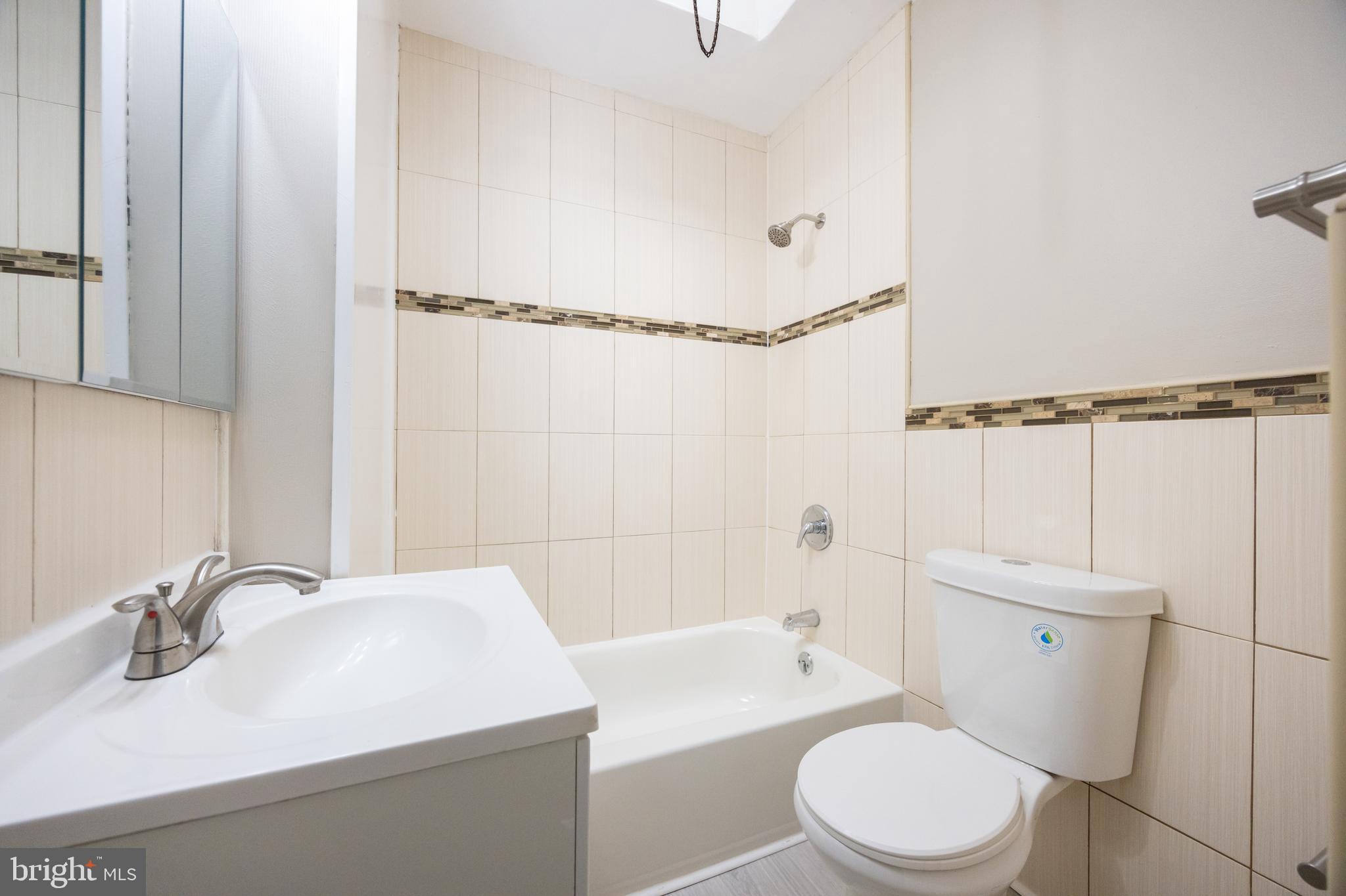 621 North 67th Street Philadelphia, PA 19151 - Photo 16 of 20 a bathroom with a sink a toilet and shower