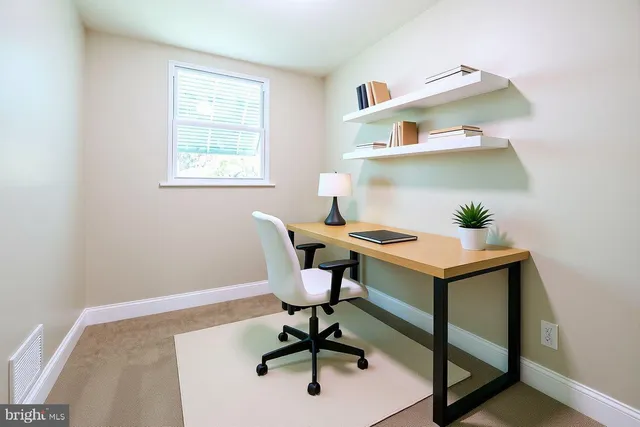 a view of a workspace with furniture