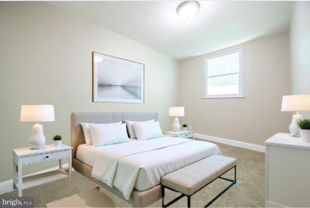 621 North 67th Street Philadelphia, PA 19151 - Photo 19 of 20 a bedroom with a bed and a lamp