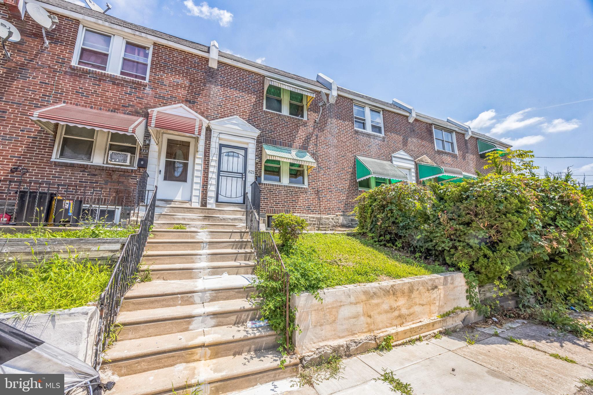 621 North 67th Street Philadelphia, PA 19151 - Photo 2 of 20 a front view of a house with a yard