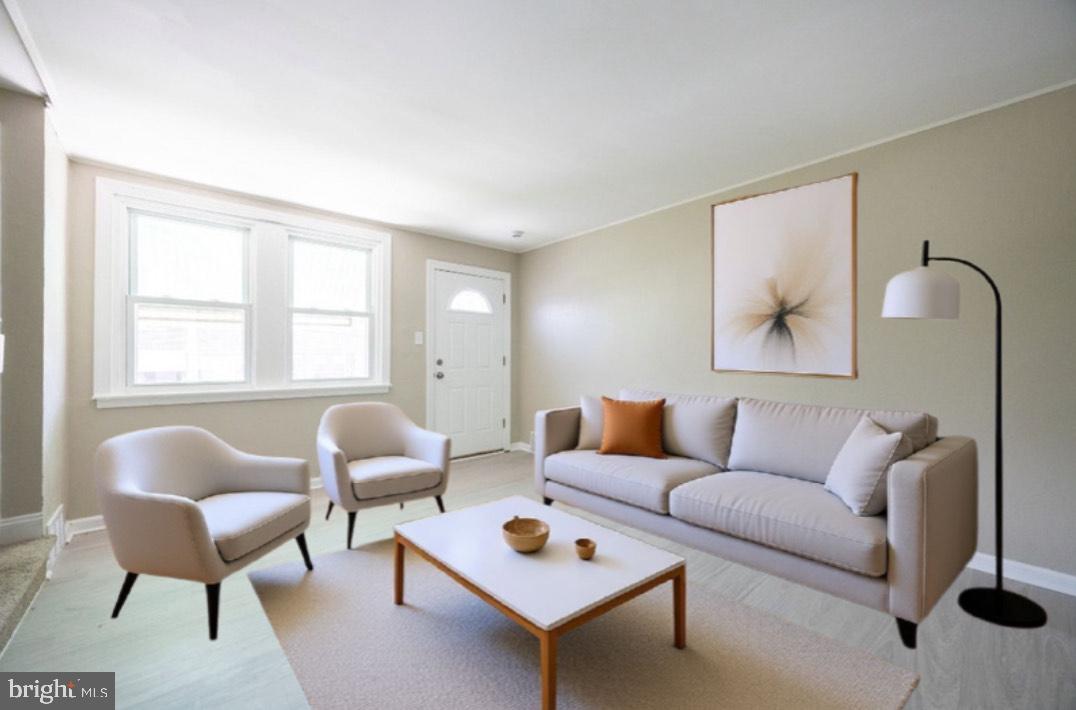 621 North 67th Street Philadelphia, PA 19151 - Photo 6 of 20 a living room with furniture and a window
