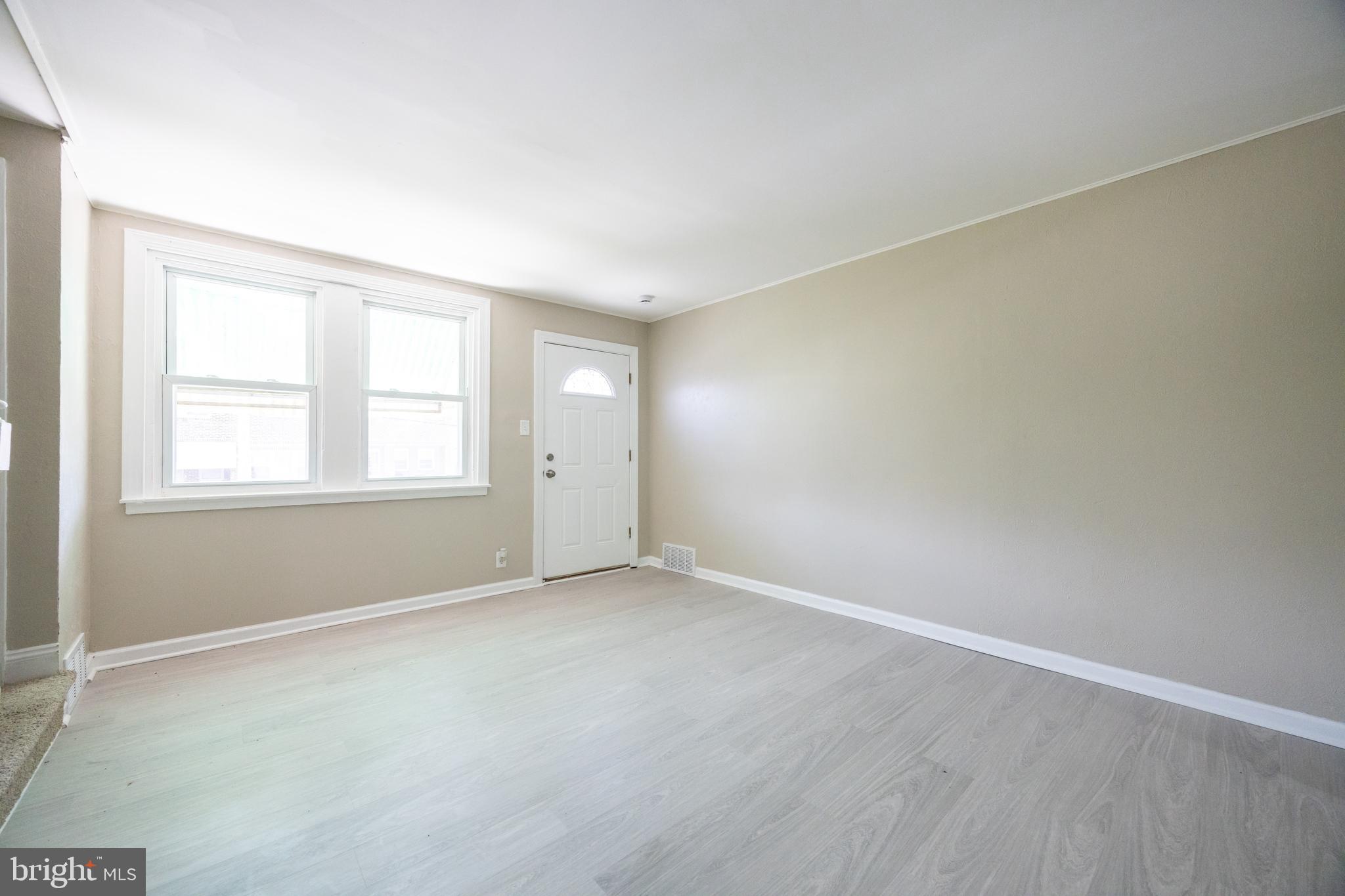 621 North 67th Street Philadelphia, PA 19151 - Photo 7 of 20 an empty room with windows