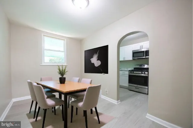 a dining room with furniture and window