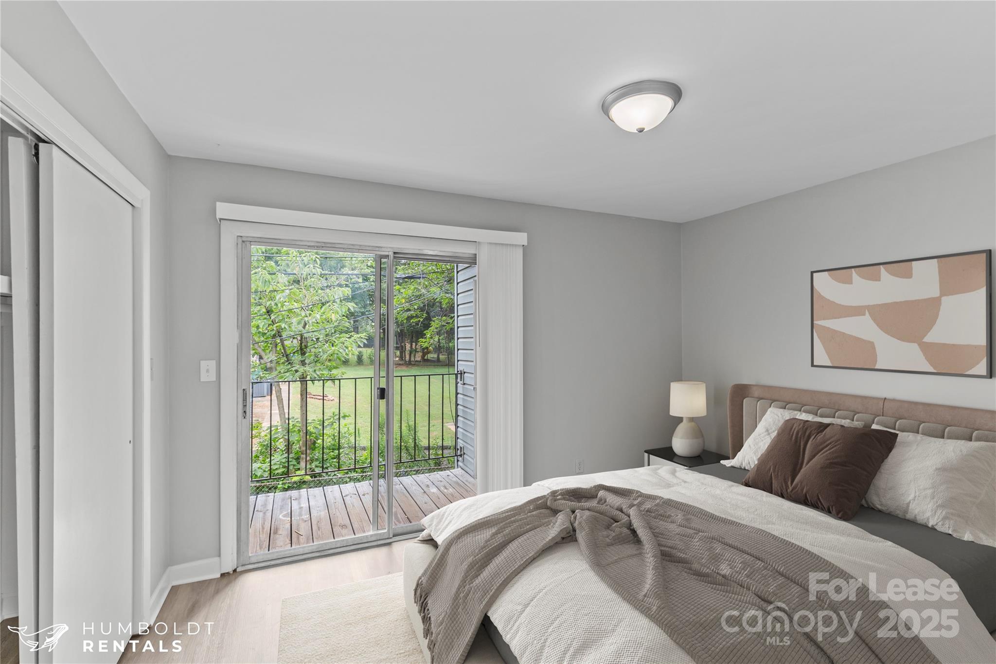 301 Eagle Road, Unit 2 Belmont, NC 28012 - Photo 14 of 15 a bedroom with a bed and a large window