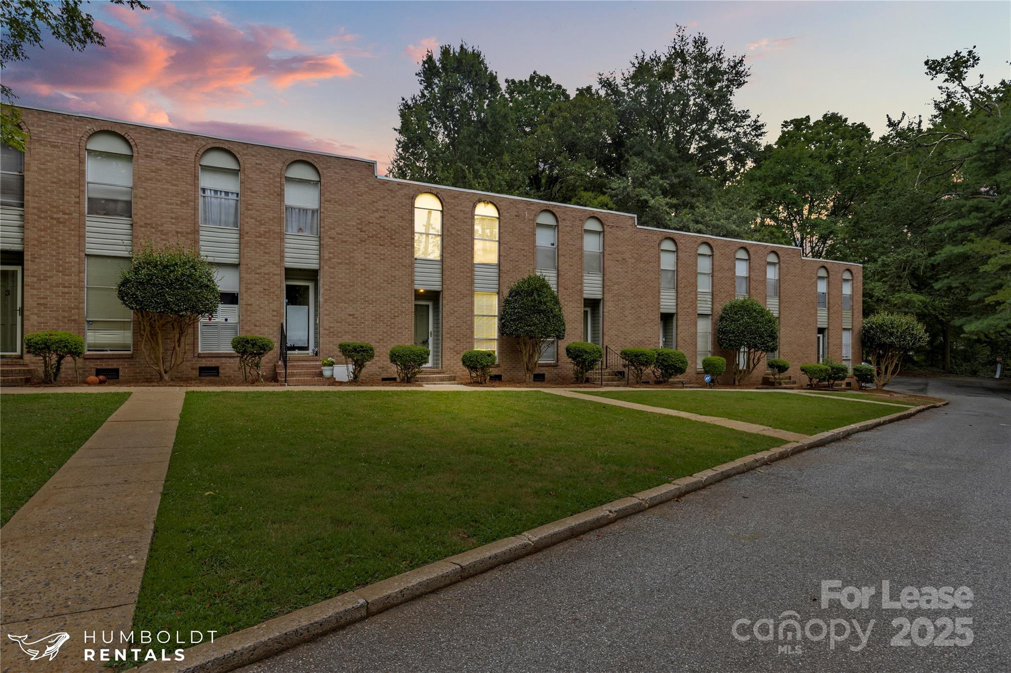 301 Eagle Road, Unit 2 Belmont, NC 28012 - Photo 2 of 15 a front view of a house with a yard