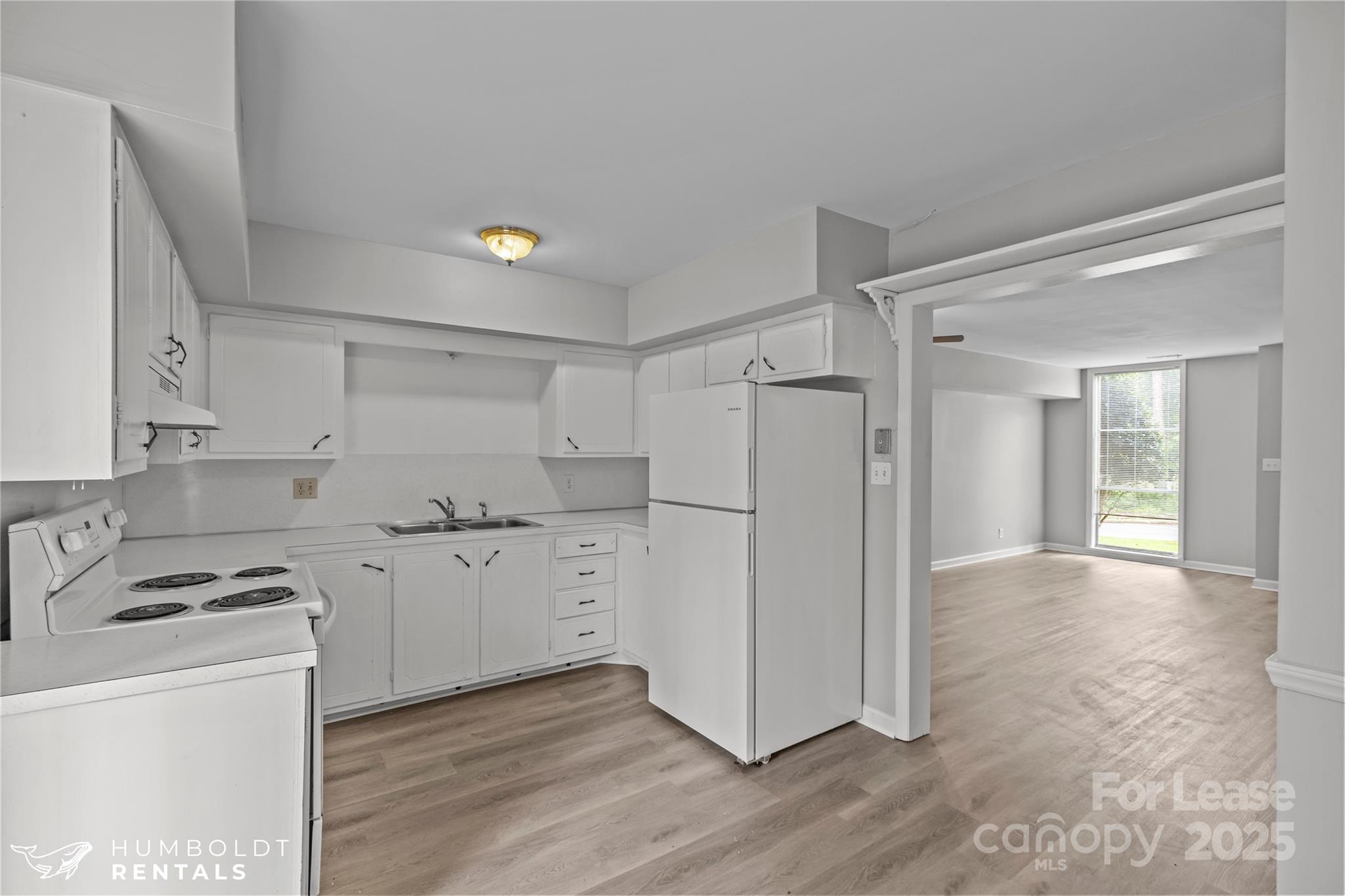 301 Eagle Road, Unit 2 Belmont, NC 28012 - Photo 6 of 15 a kitchen with granite countertop cabinets and refrigerator