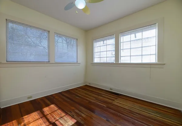 a view of room with wooden floor