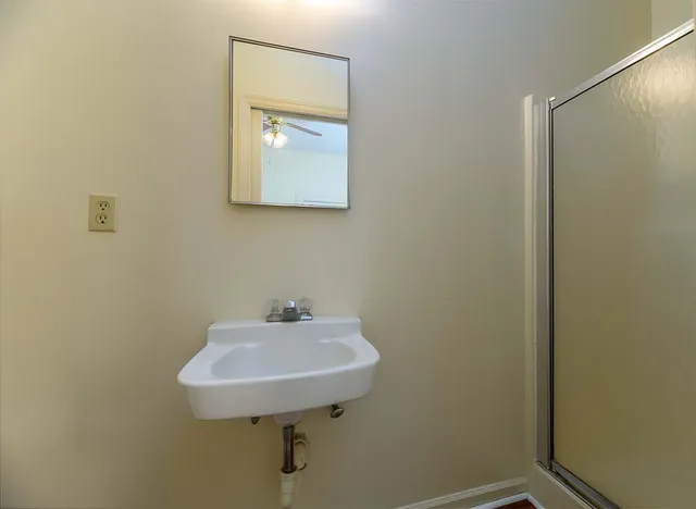 a view of a kitchen with wooden floor