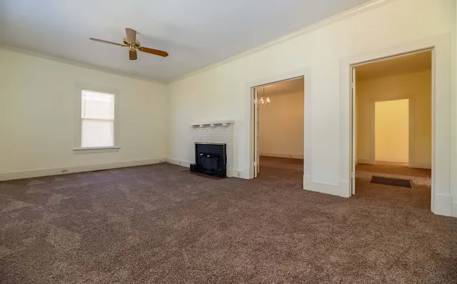 a view of empty room with fireplace