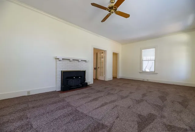 a kitchen with stainless steel appliances granite countertop a sink a stove and a microwave oven