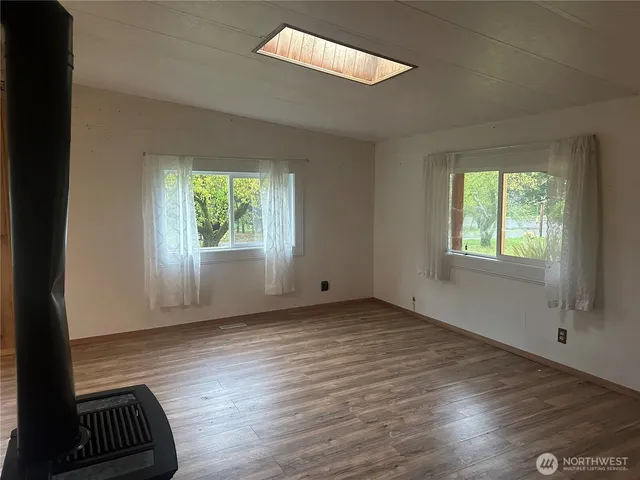 a kitchen with stainless steel appliances granite countertop a stove a refrigerator and a sink