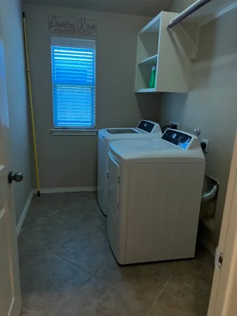 a utility room with washer and dryer