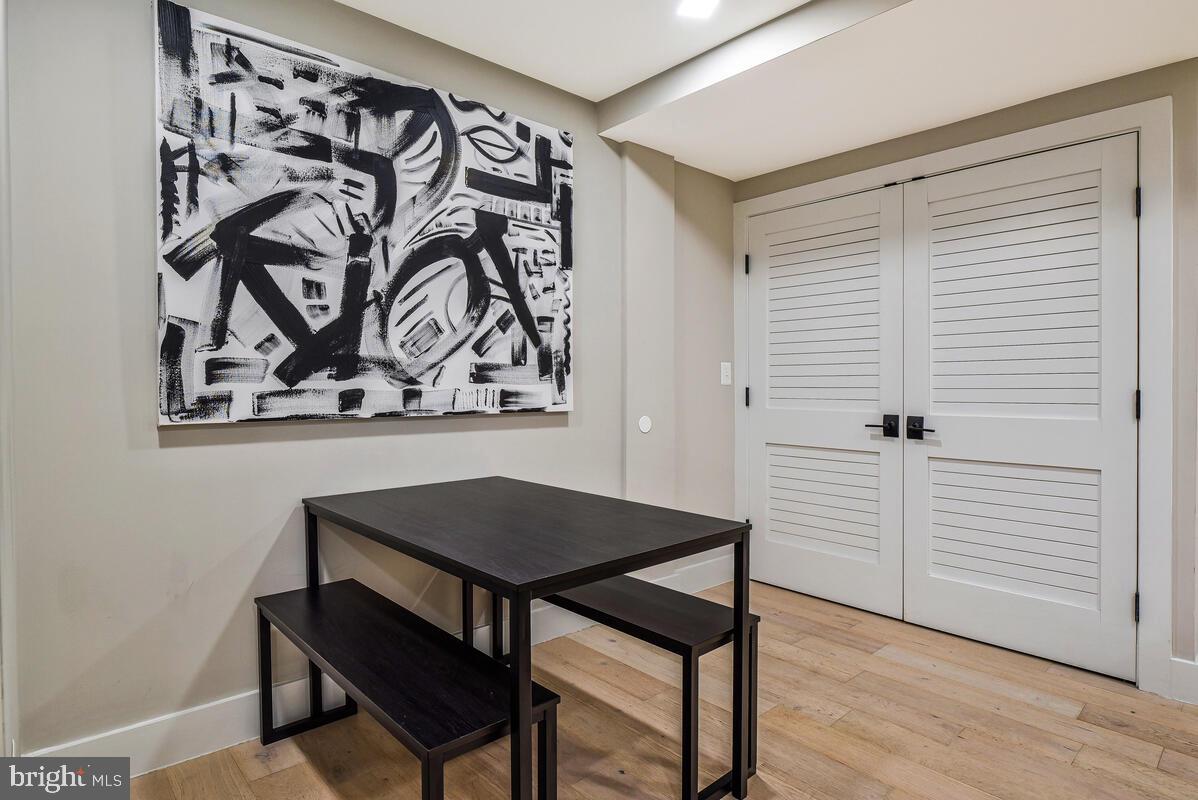 1028 Bladensburg Road Northeast, Unit 5 Washington, DC 20002 - Photo 14 of 29 wooden floor with a table and chair