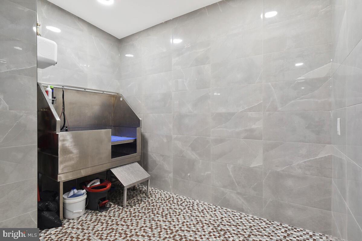 1028 Bladensburg Road Northeast, Unit 5 Washington, DC 20002 - Photo 24 of 29 a bathroom with a sink toilet and shower