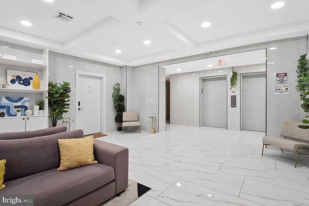 1028 Bladensburg Road Northeast, Unit 5 Washington, DC 20002 - Photo 25 of 29 a living room with furniture and a large window