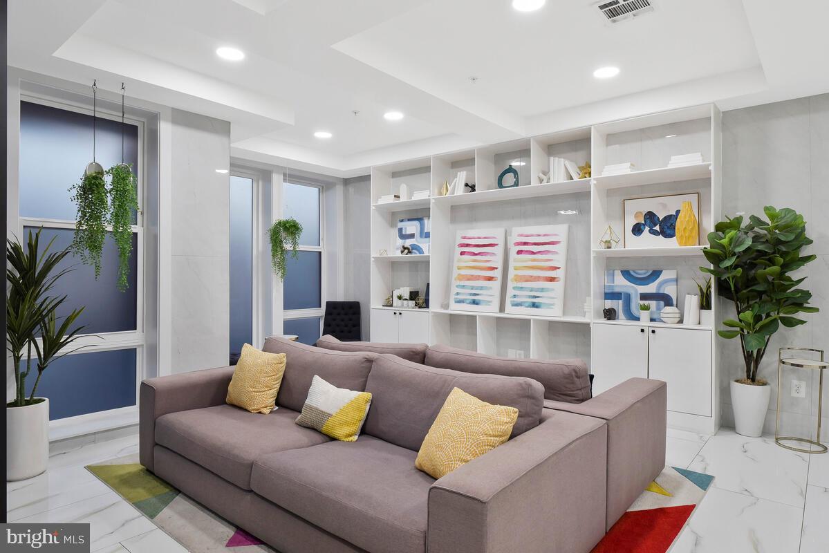 1028 Bladensburg Road Northeast, Unit 5 Washington, DC 20002 - Photo 26 of 29 a living room with furniture and a large window