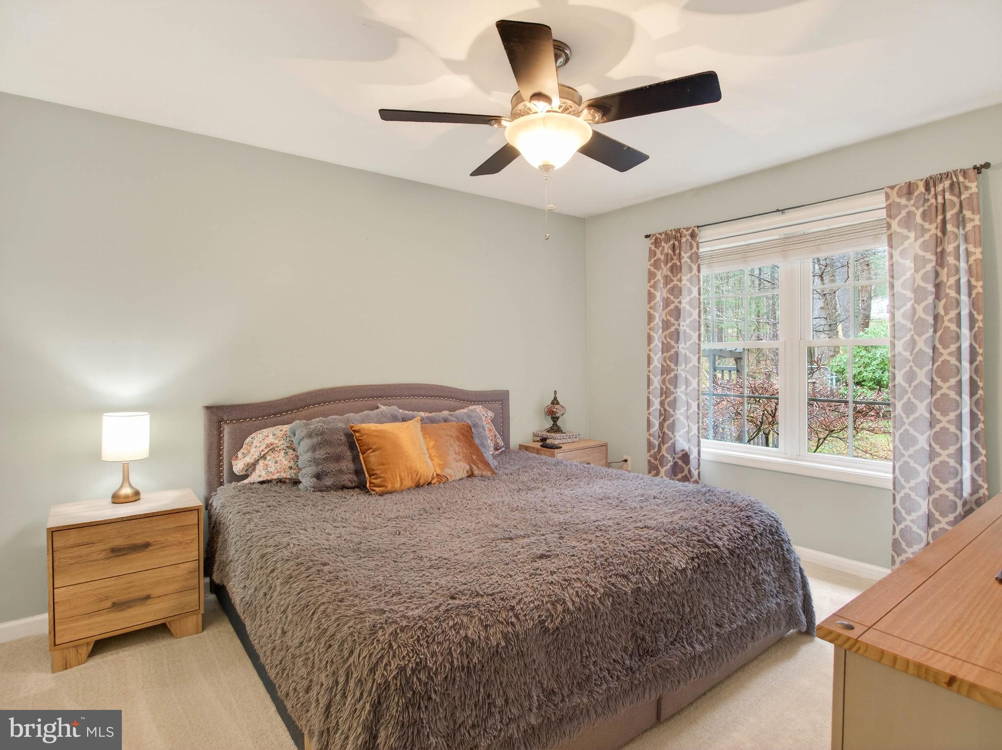 2586 West Hoover Road Haywood, VA 22722 - Photo 19 of 35 a bedroom with a large bed and a window