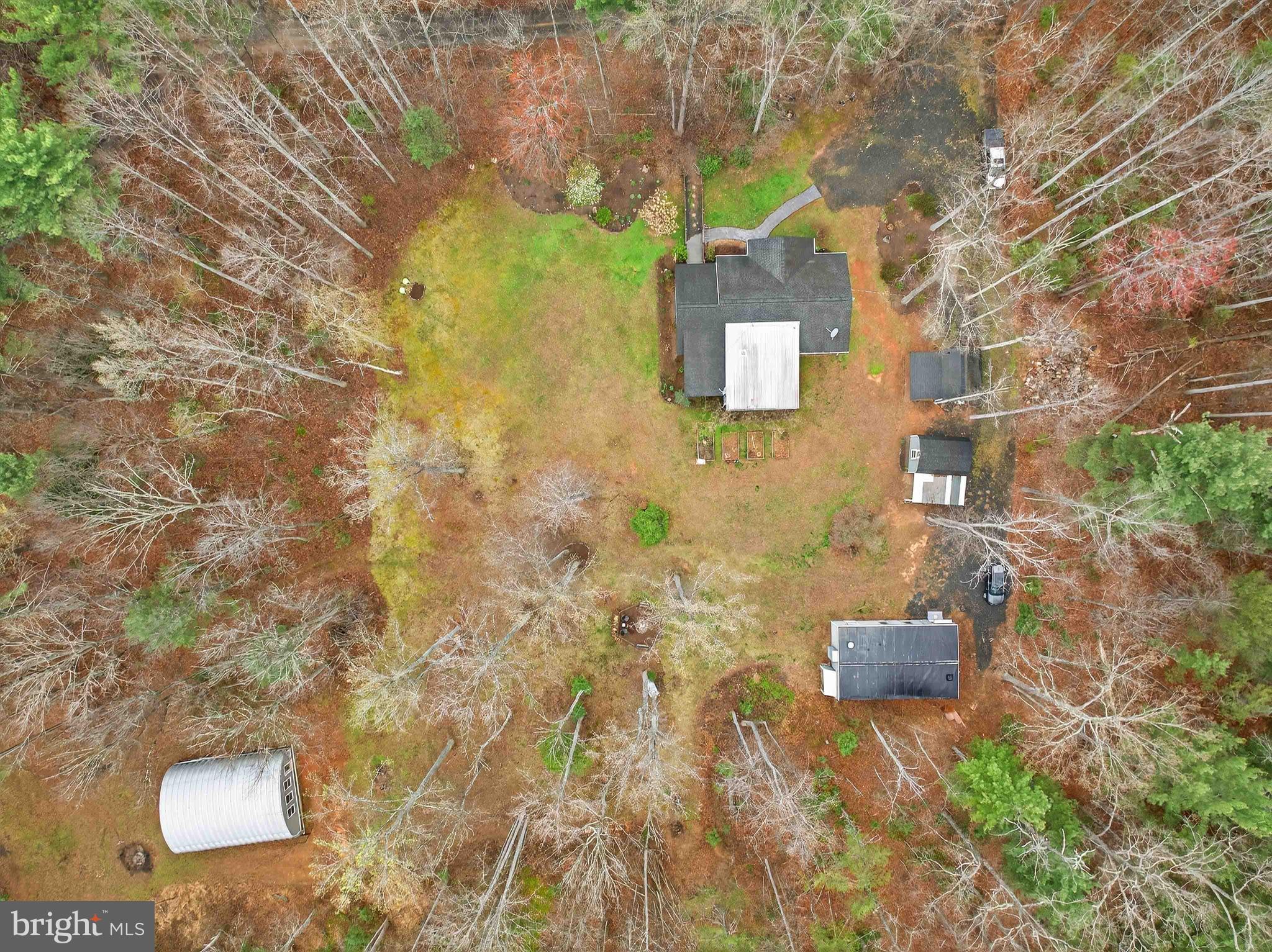 2586 West Hoover Road Haywood, VA 22722 - Photo 28 of 35 a backyard of a house with table and chairs