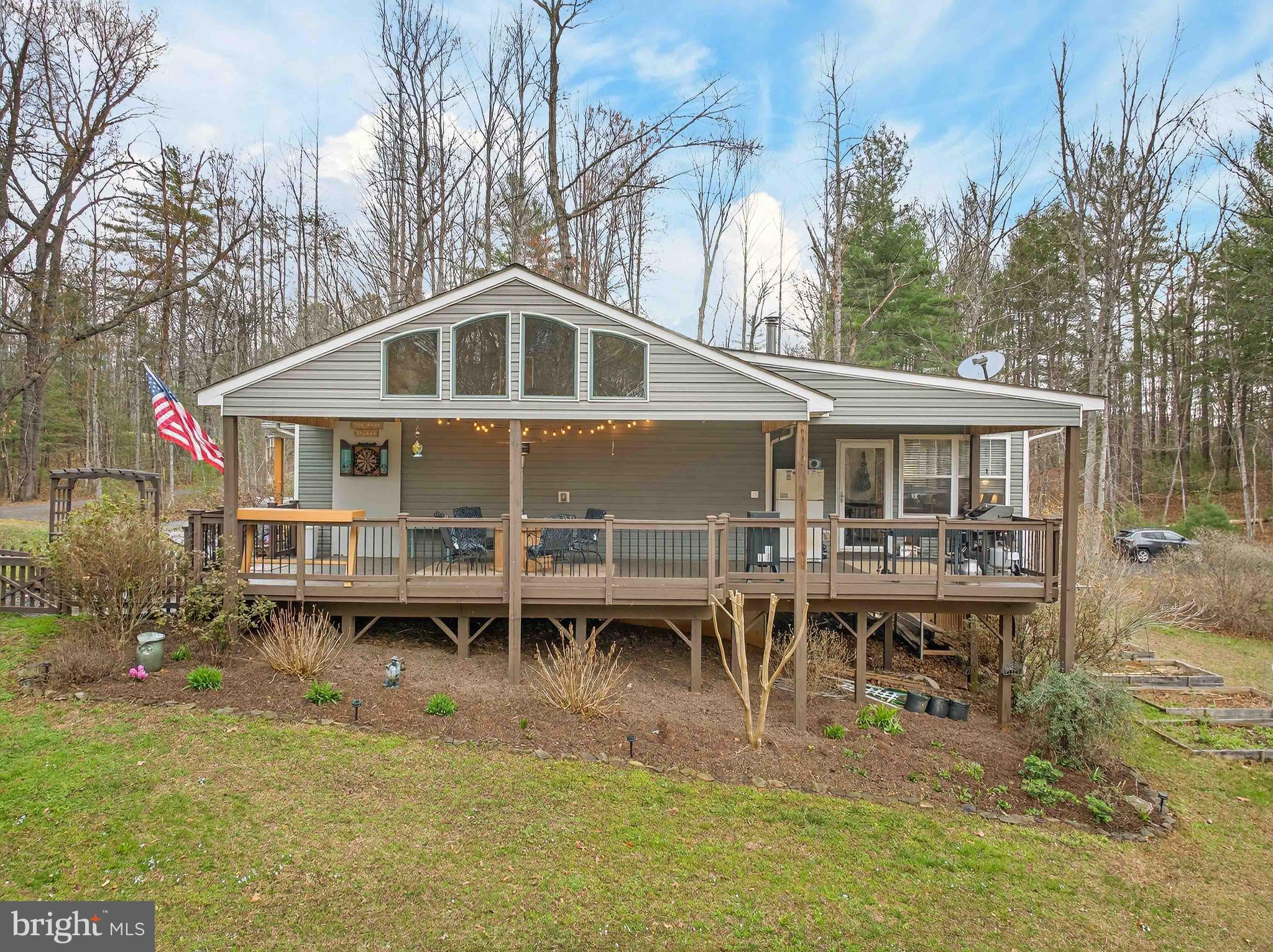 2586 West Hoover Road Haywood, VA 22722 - Photo 34 of 35 a front view of a house with a yard table and chairs