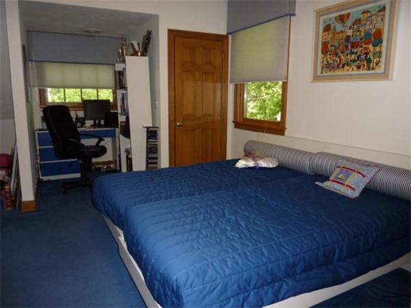 110 Clark Road Brookline, MA 02445 - Photo 8 of 10 a bedroom with a bed and a window