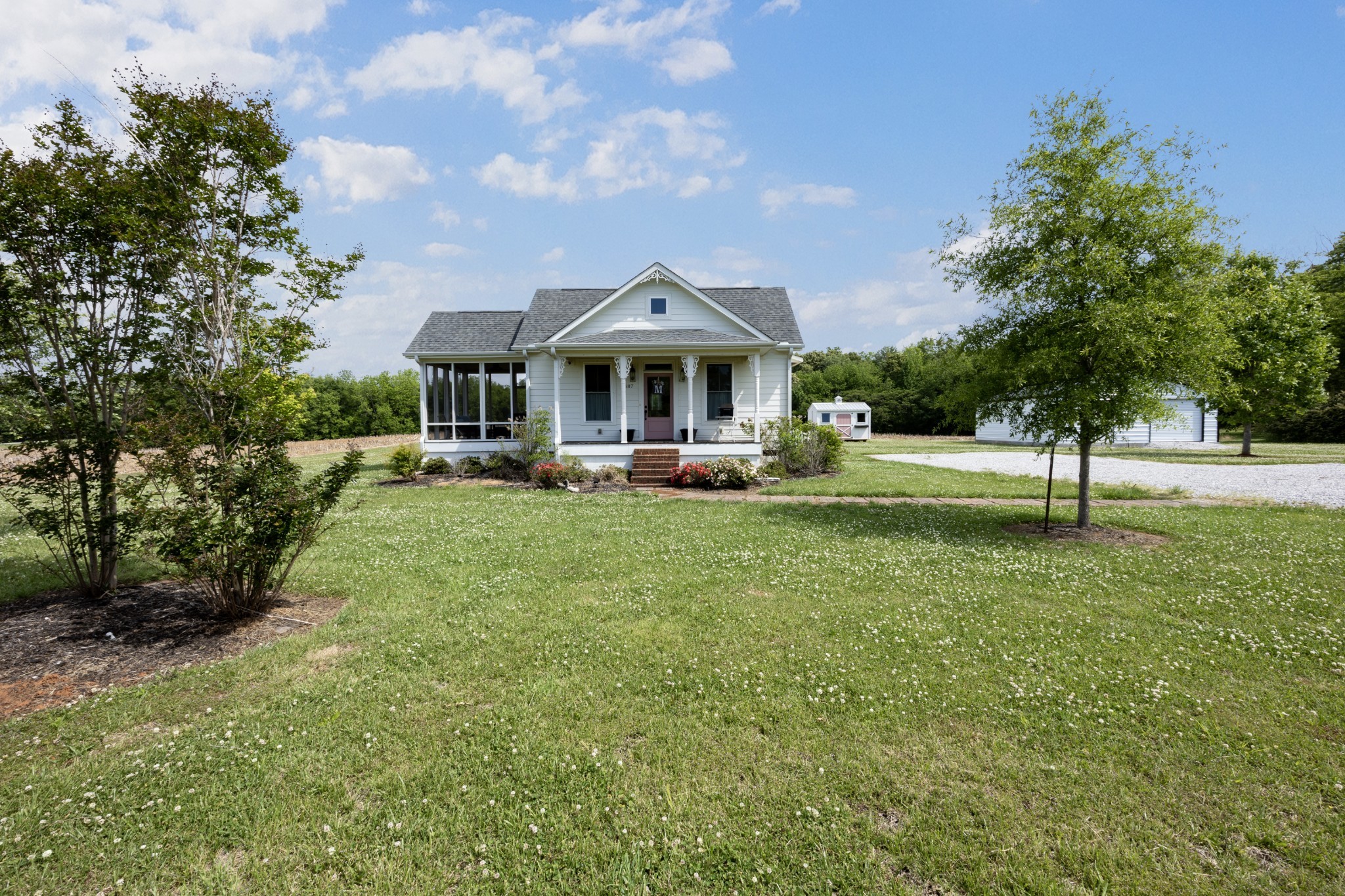a front view of a house with garden