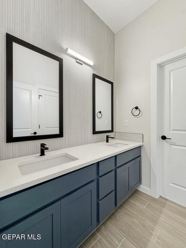 7248 Cimarron Rim Drive El Paso, TX 79911 - Photo 42 of 48 a bathroom with a double vanity sink and a mirror