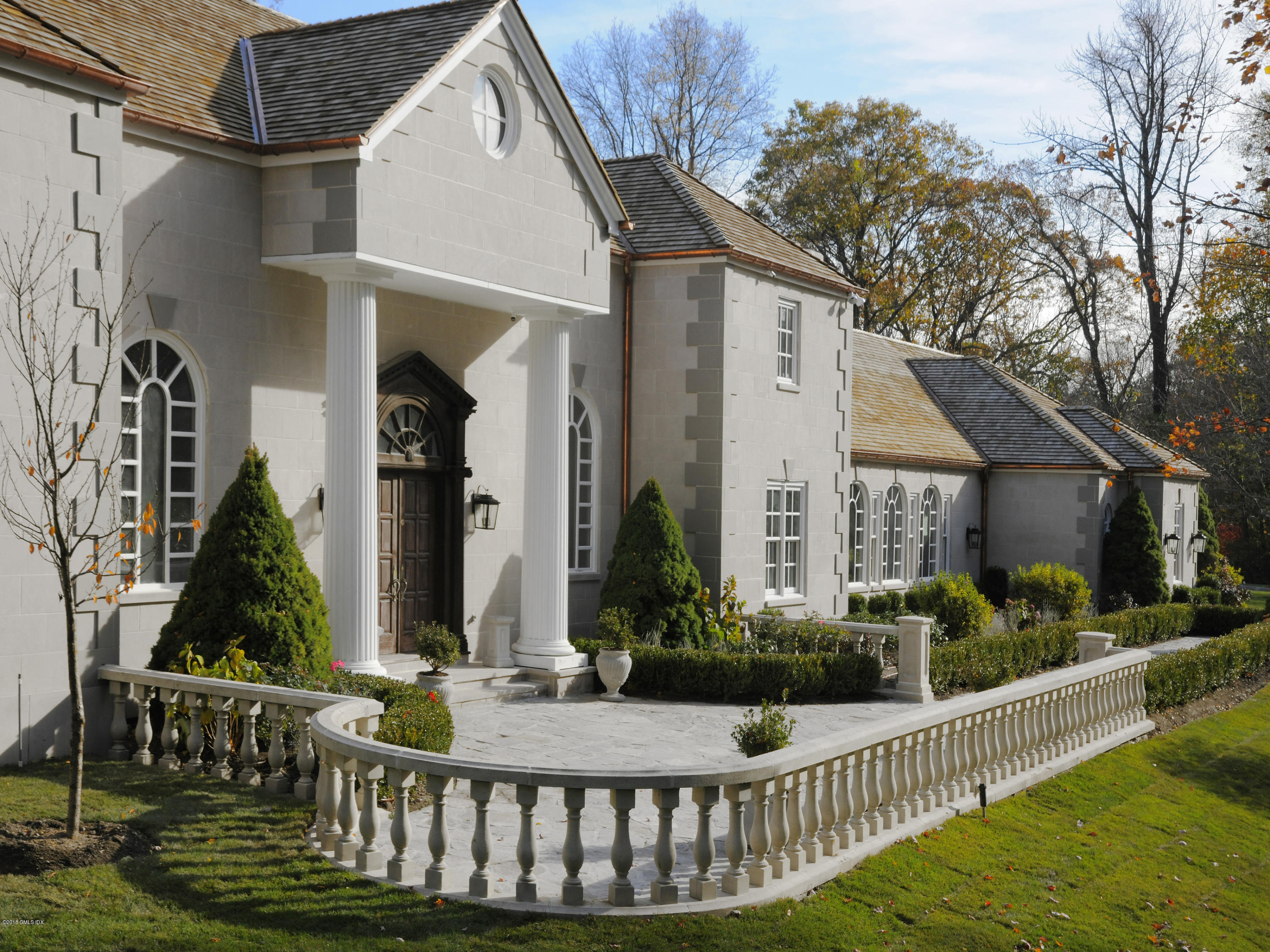 36 Perkins Road Greenwich, CT 06830 - Photo 11 of 26 a front view of a house having yard