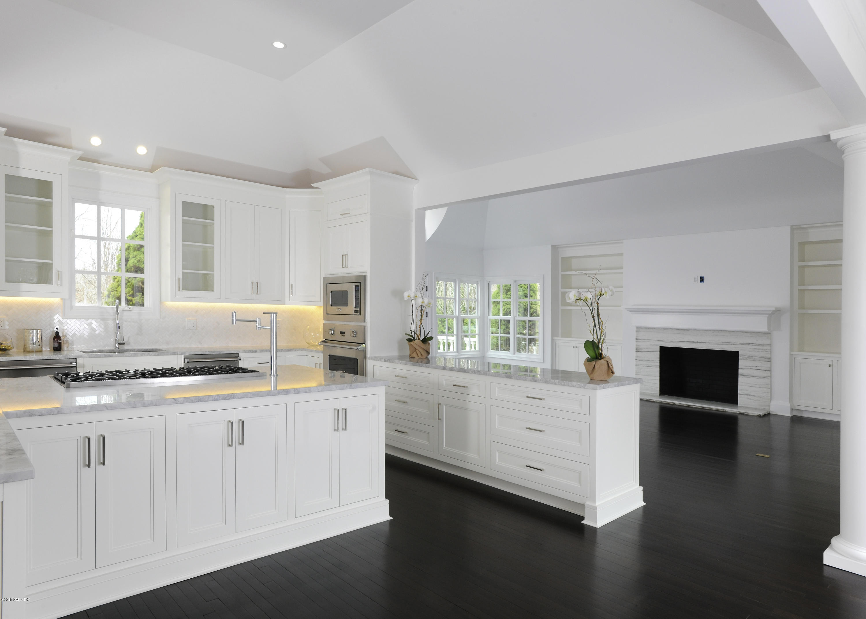 36 Perkins Road Greenwich, CT 06830 - Photo 15 of 26 a kitchen with granite countertop white cabinets and white appliances