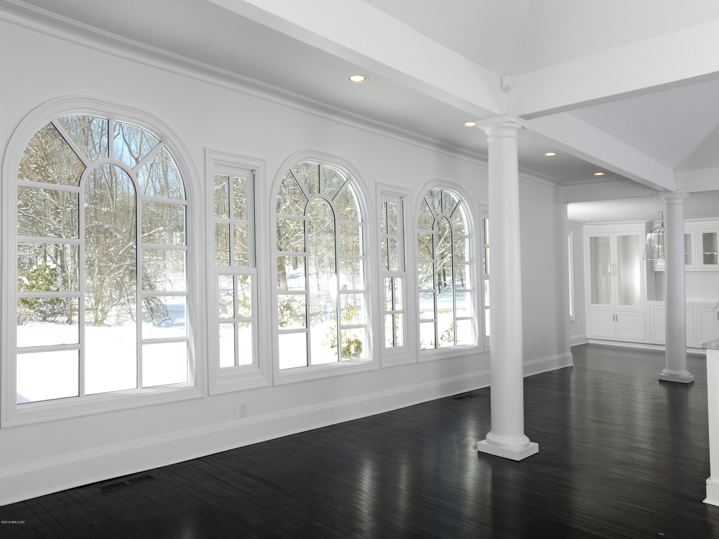 36 Perkins Road Greenwich, CT 06830 - Photo 18 of 26 a view of an empty room with wooden floor and a window