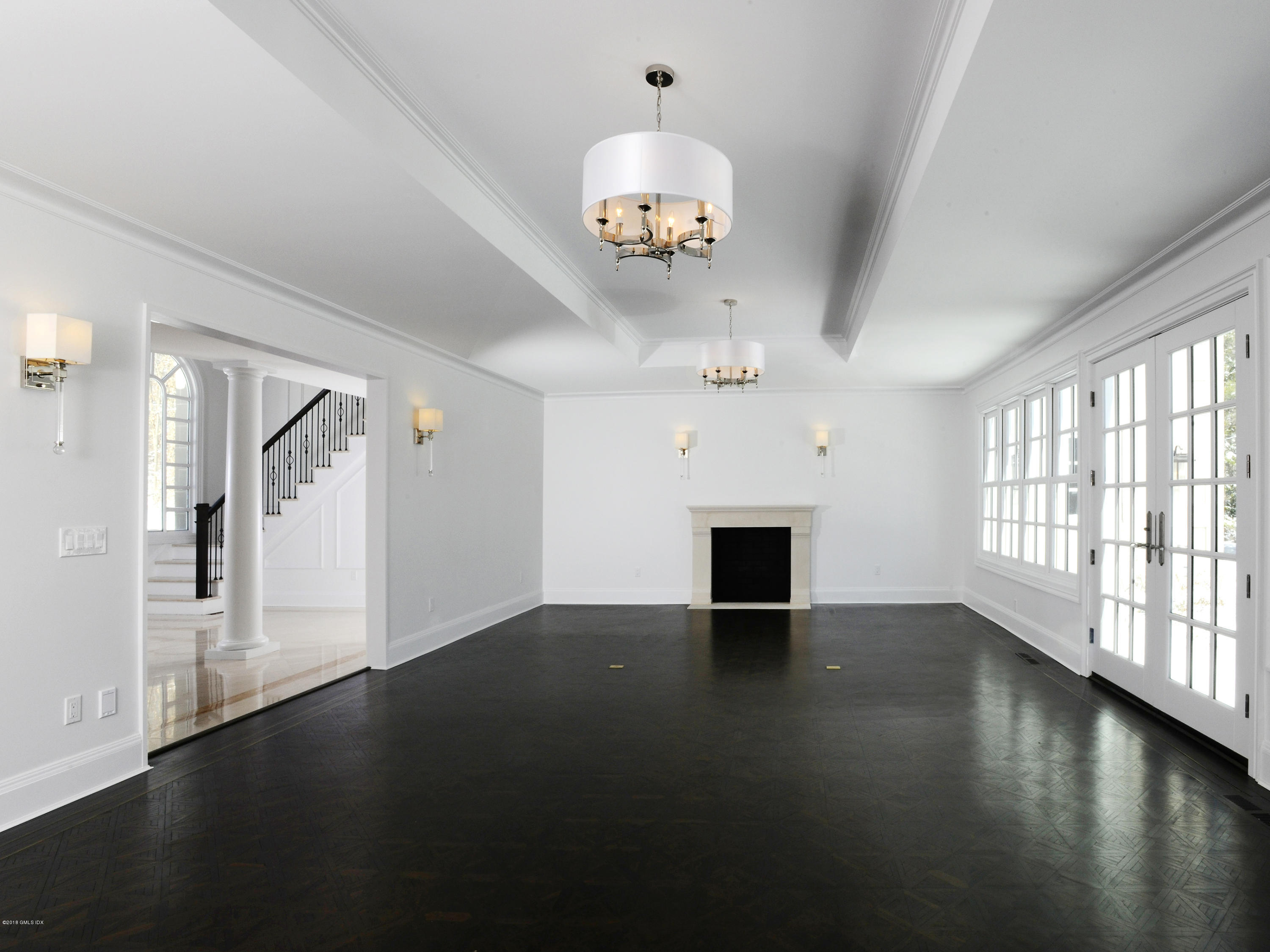 36 Perkins Road Greenwich, CT 06830 - Photo 19 of 26 a view of an empty room with wooden floor and a window