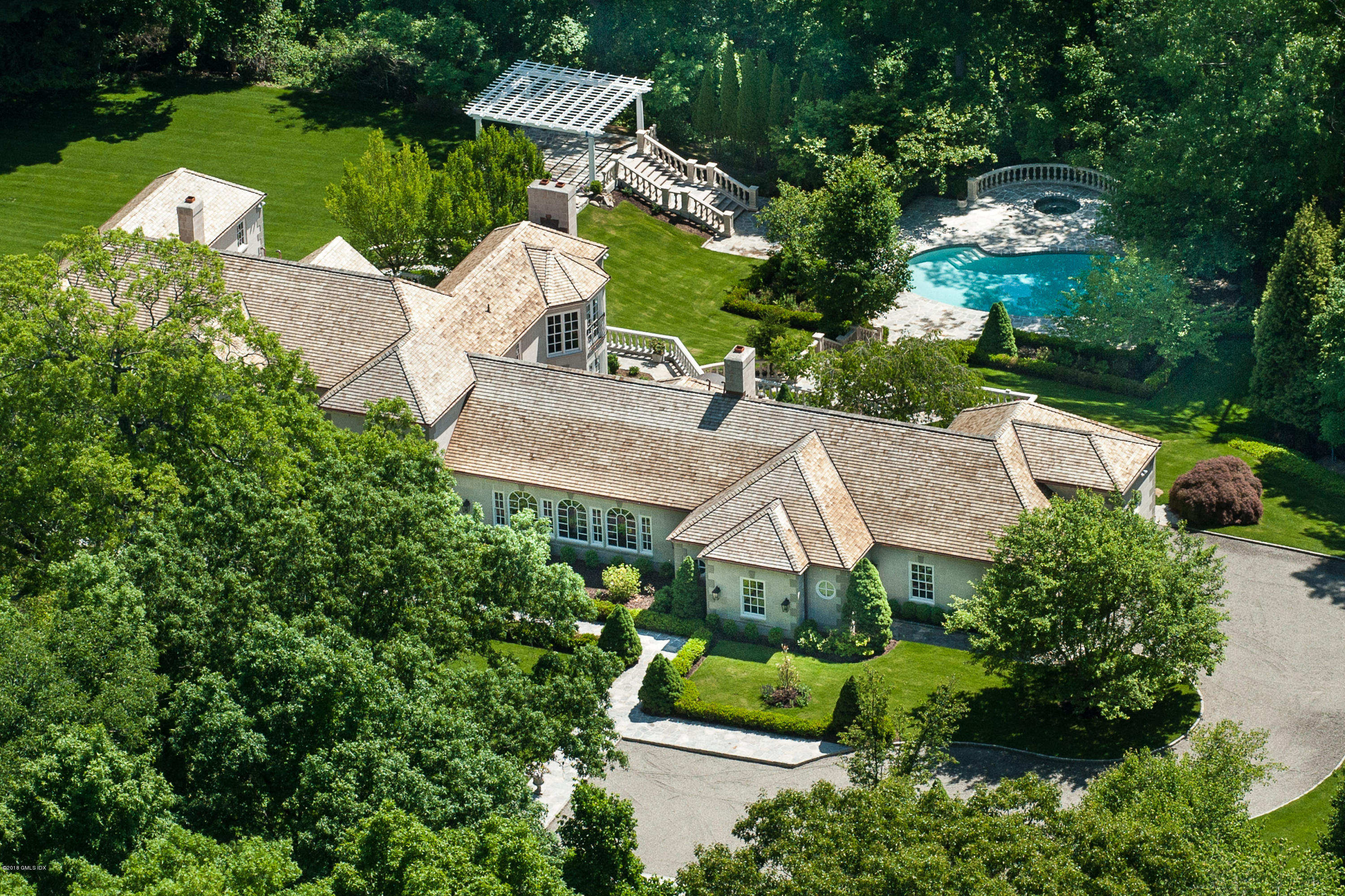 36 Perkins Road Greenwich, CT 06830 - Photo 2 of 26 an aerial view of a house with yard swimming pool and outdoor seating