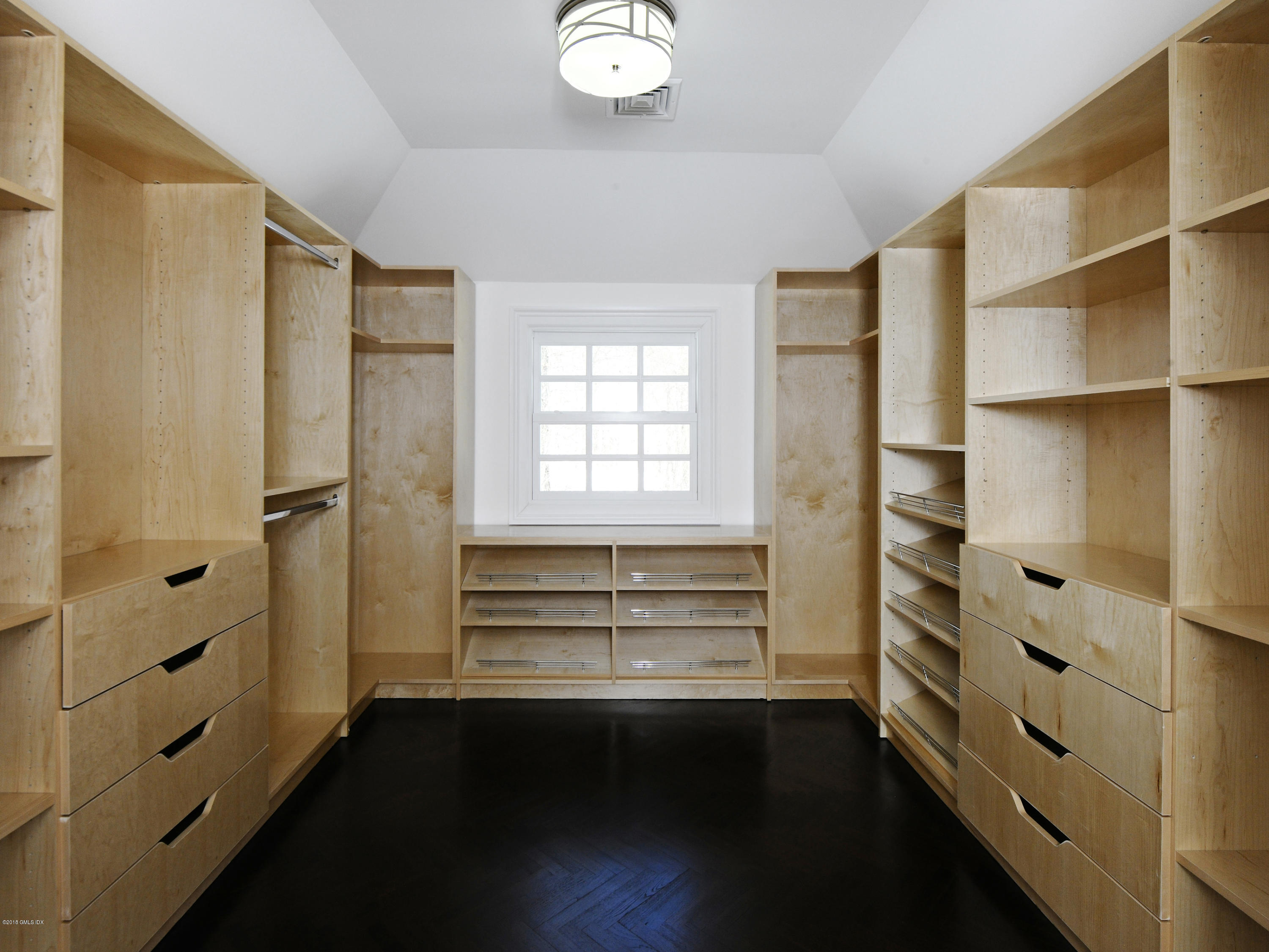 36 Perkins Road Greenwich, CT 06830 - Photo 26 of 26 a view of walk in closet with empty racks