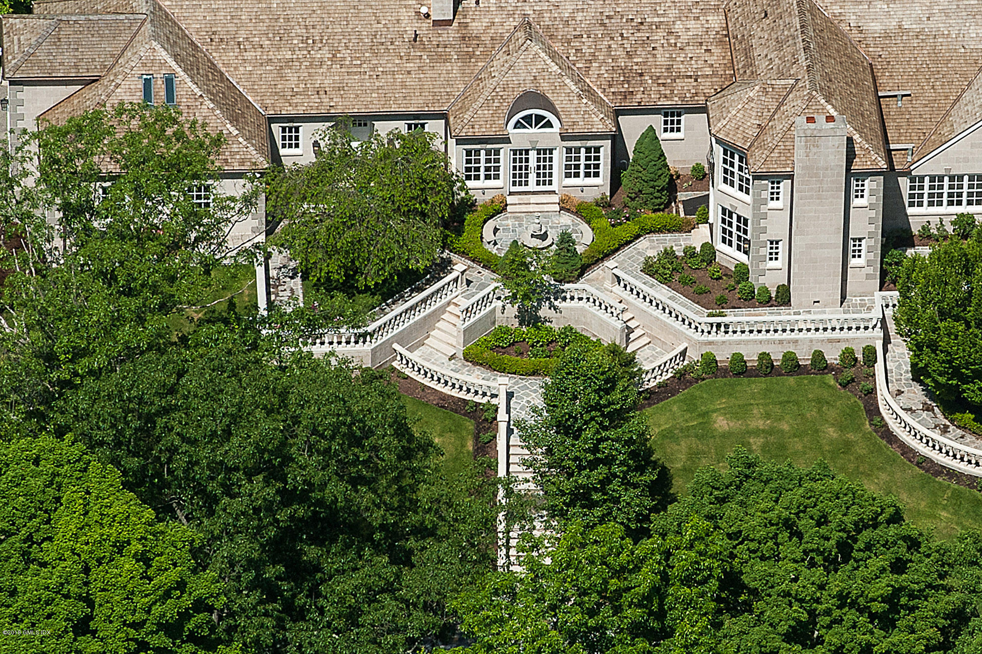 36 Perkins Road Greenwich, CT 06830 - Photo 4 of 26 an aerial view of a house with garden outdoor seating and swimming pool