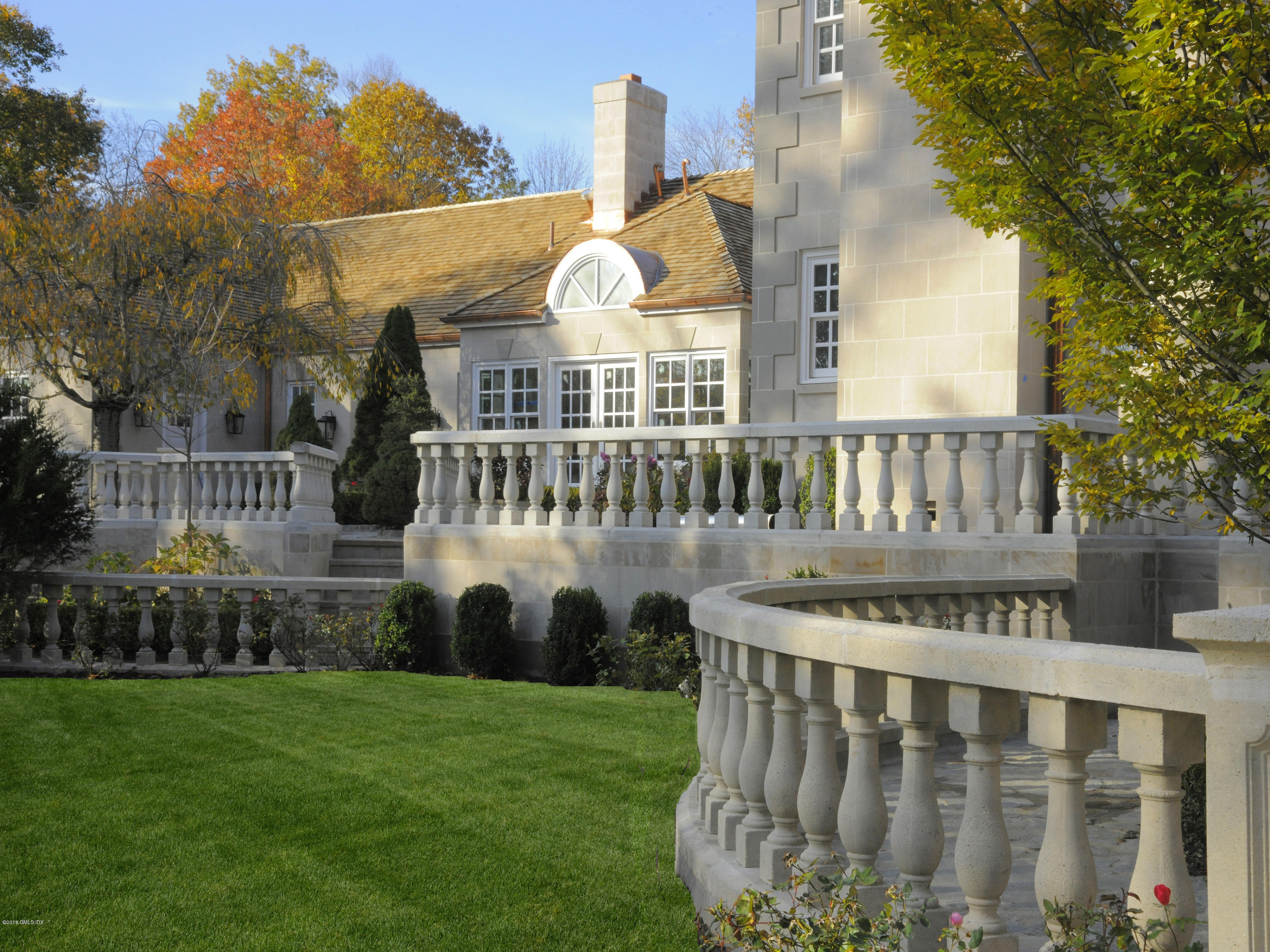 36 Perkins Road Greenwich, CT 06830 - Photo 5 of 26 a view of a chair and table in the backyard