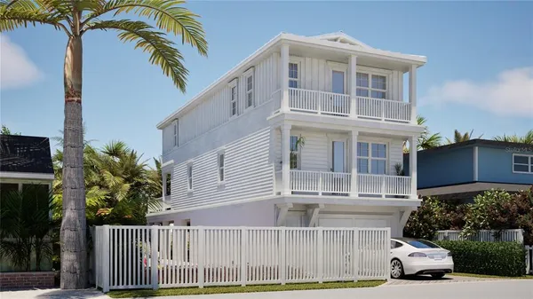 a view of a house with a yard and potted plants