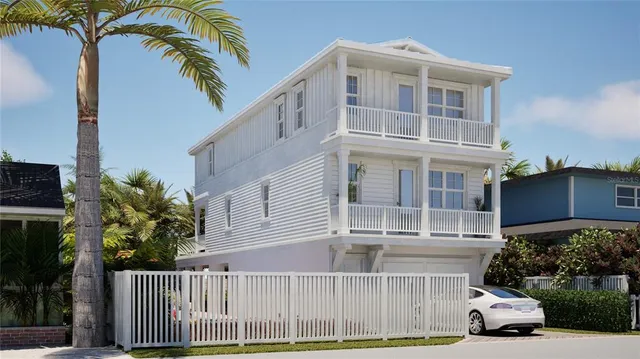 a view of a house with a yard and potted plants