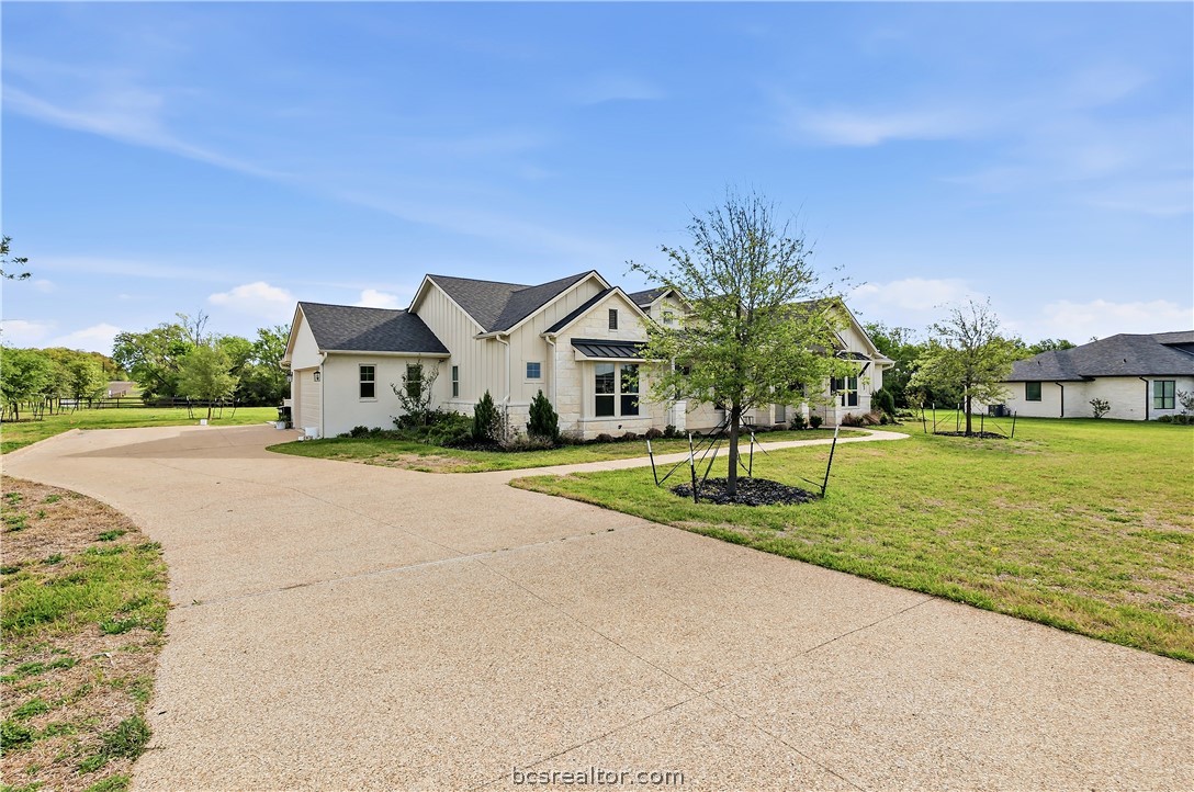 10701 Harvey Ranch Road College Station, TX 77845 - Photo 2 of 48 a view of a house with a big yard and potted plants