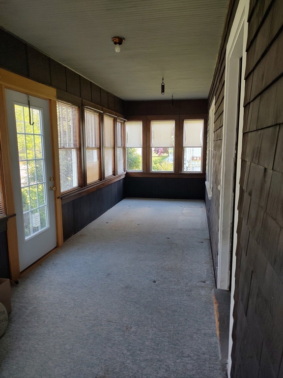 577 County Street Taunton, MA 02780 - Photo 20 of 23 a view of a big room with windows and chandelier fan