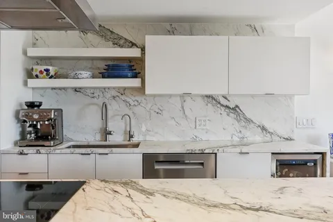 a bedroom with a bed and cabinets