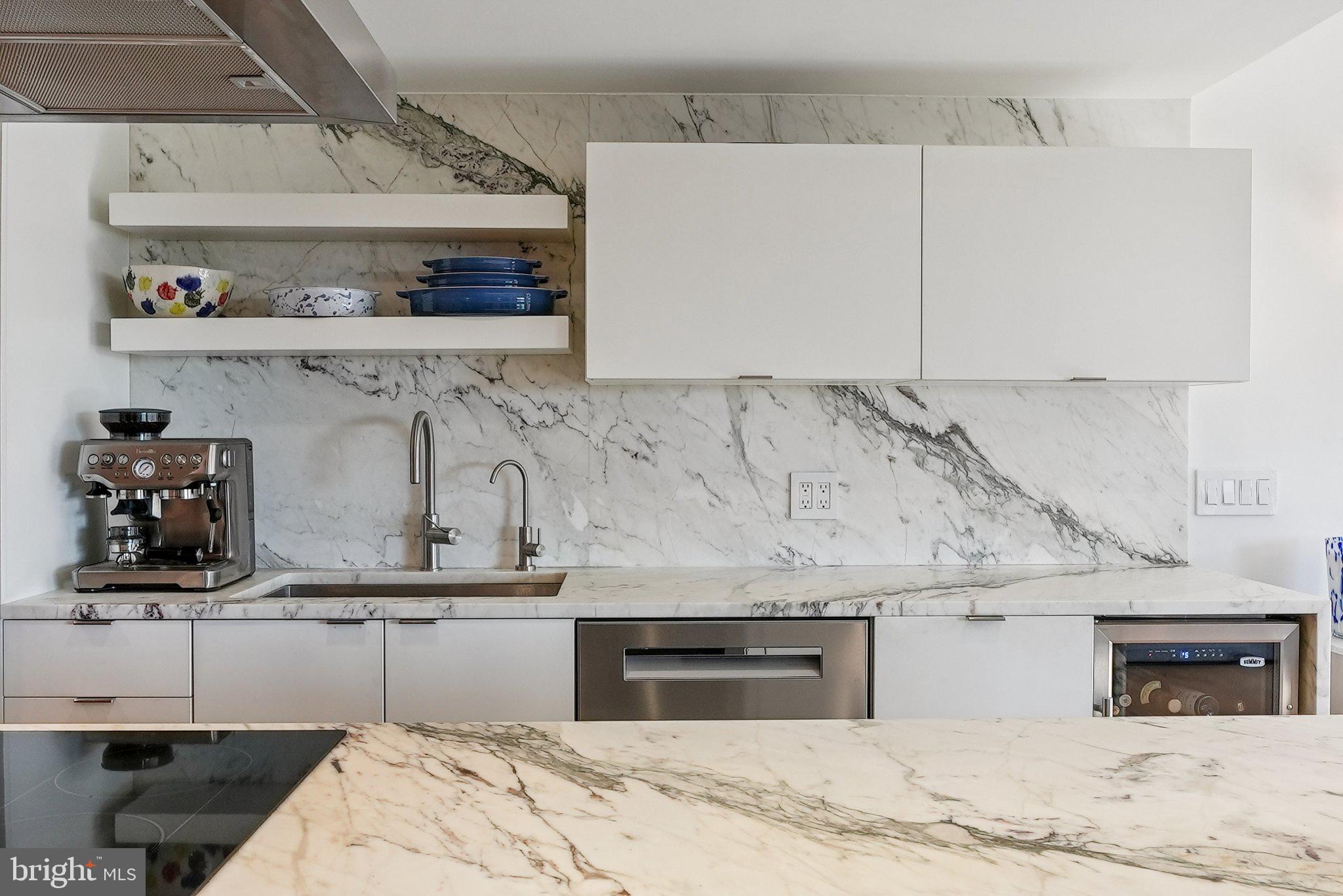 1015 33rd Street Northwest, Unit 809 Washington, DC 20007 - Photo 13 of 39 a bedroom with a bed and cabinets