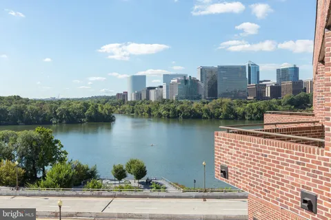 a bathroom with a sink mirror and toilet