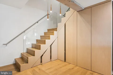a view of hallway with wooden floor