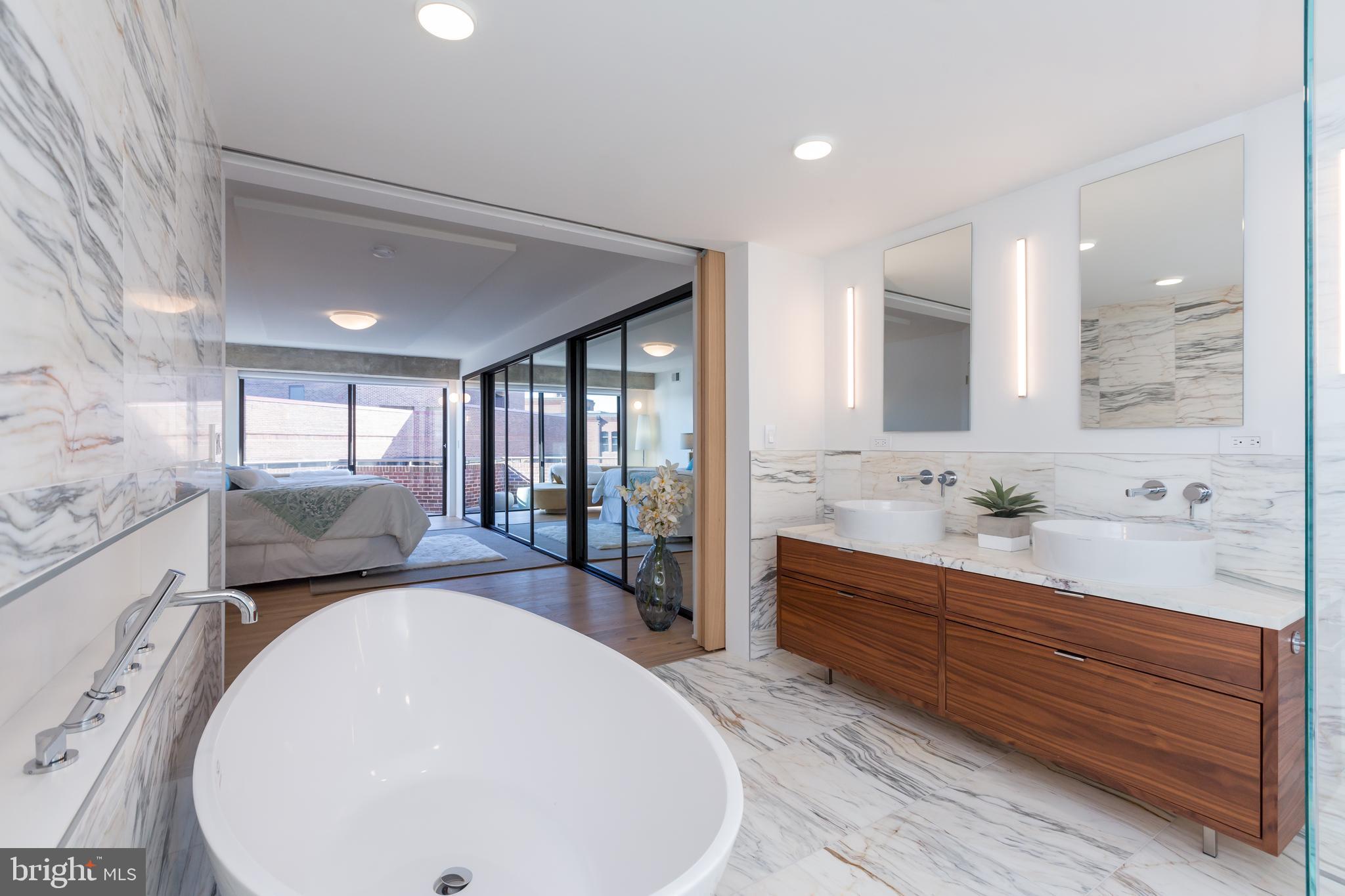 1015 33rd Street Northwest, Unit 809 Washington, DC 20007 - Photo 27 of 39 a en suite bathroom with sink mirror and double