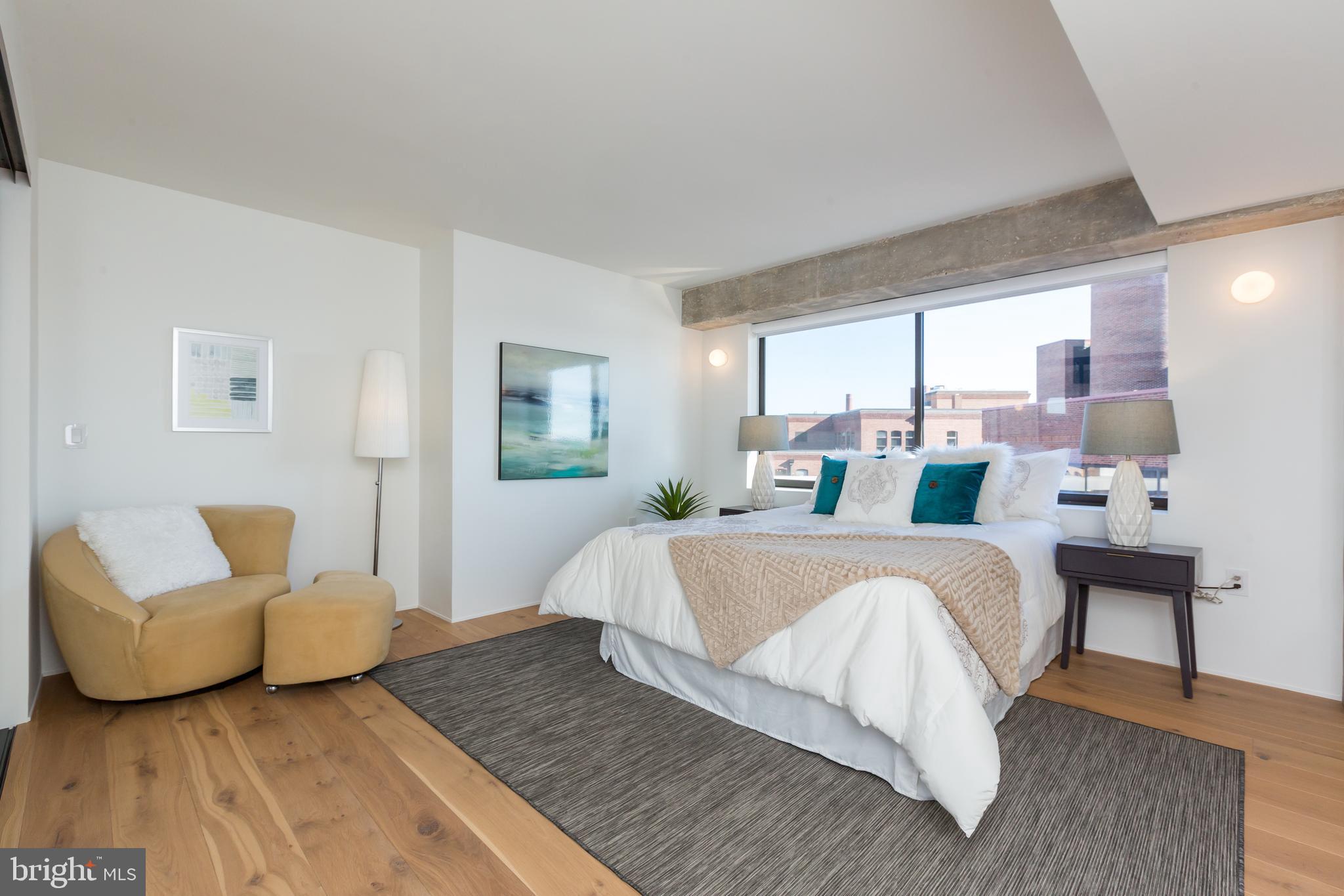 1015 33rd Street Northwest, Unit 809 Washington, DC 20007 - Photo 28 of 39 a bed room with a bed and a couch