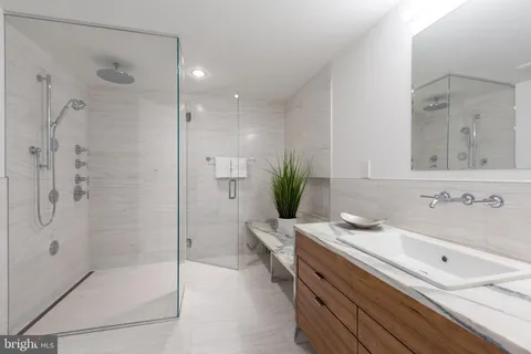 an aerial view of a house with a yard and potted plants