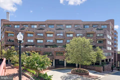 a front view of a building with garden